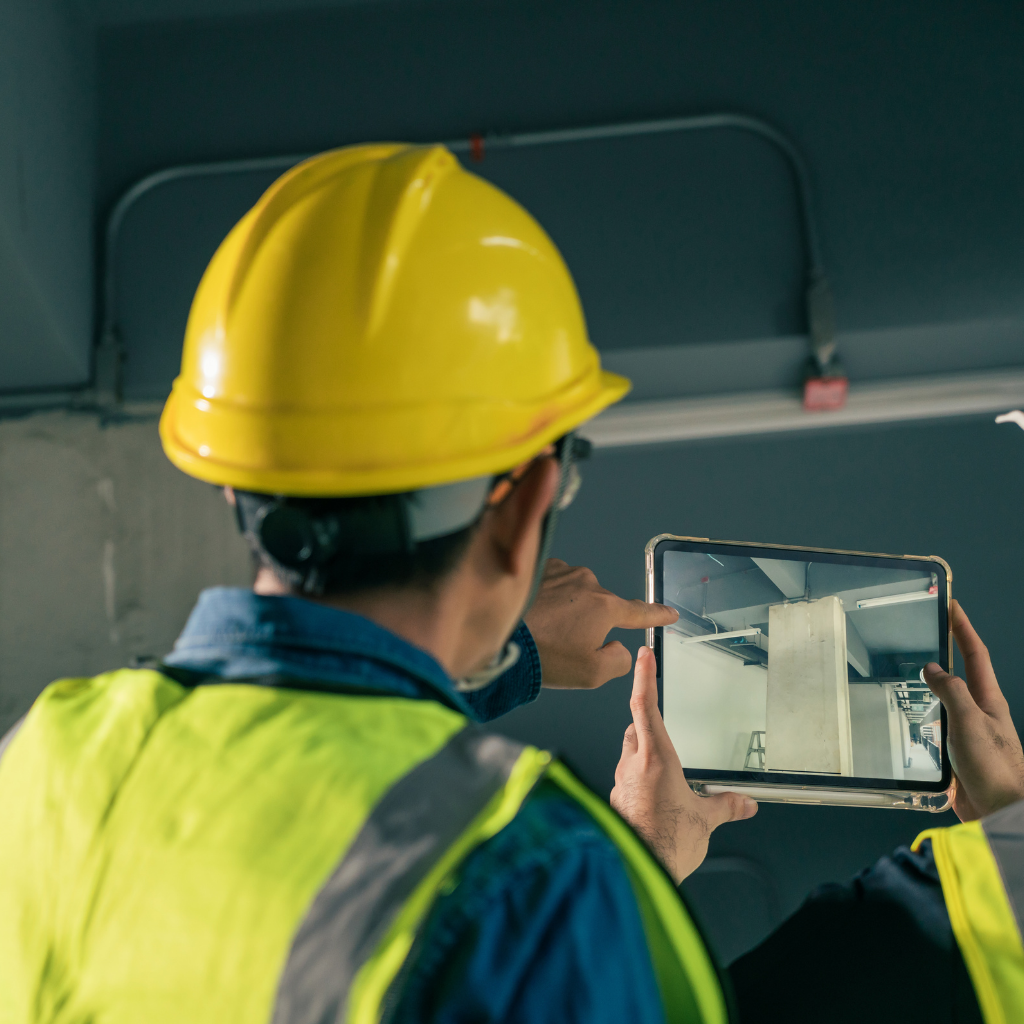 Modern construction site with digital tools, laser measuring devices, drones, and automated machinery